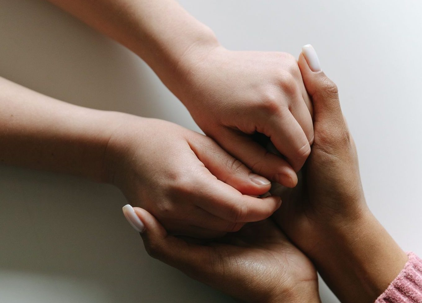 close up of people holding their hands